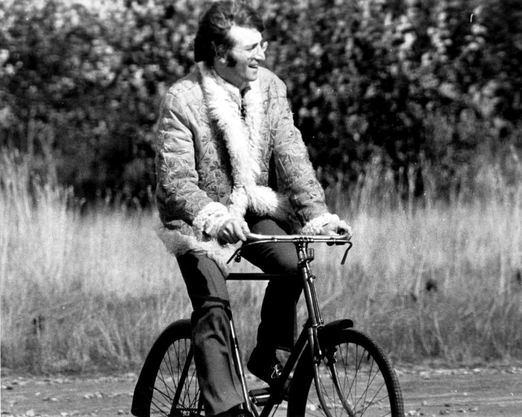 John Lennon riding his bike