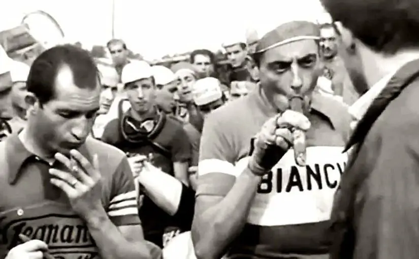 Fausto Coppi and Gino Bartali smoking cigars (featured)
