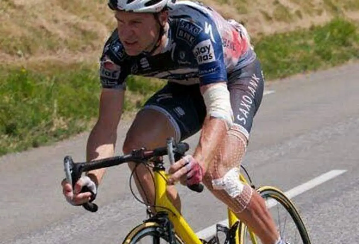Jens Voigt borrows a kid's bike during the Tour de France 2010