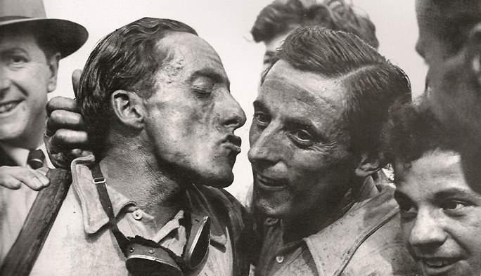 Serse Coppi kisses Fausto Coppi after Paris Roubaix 1949