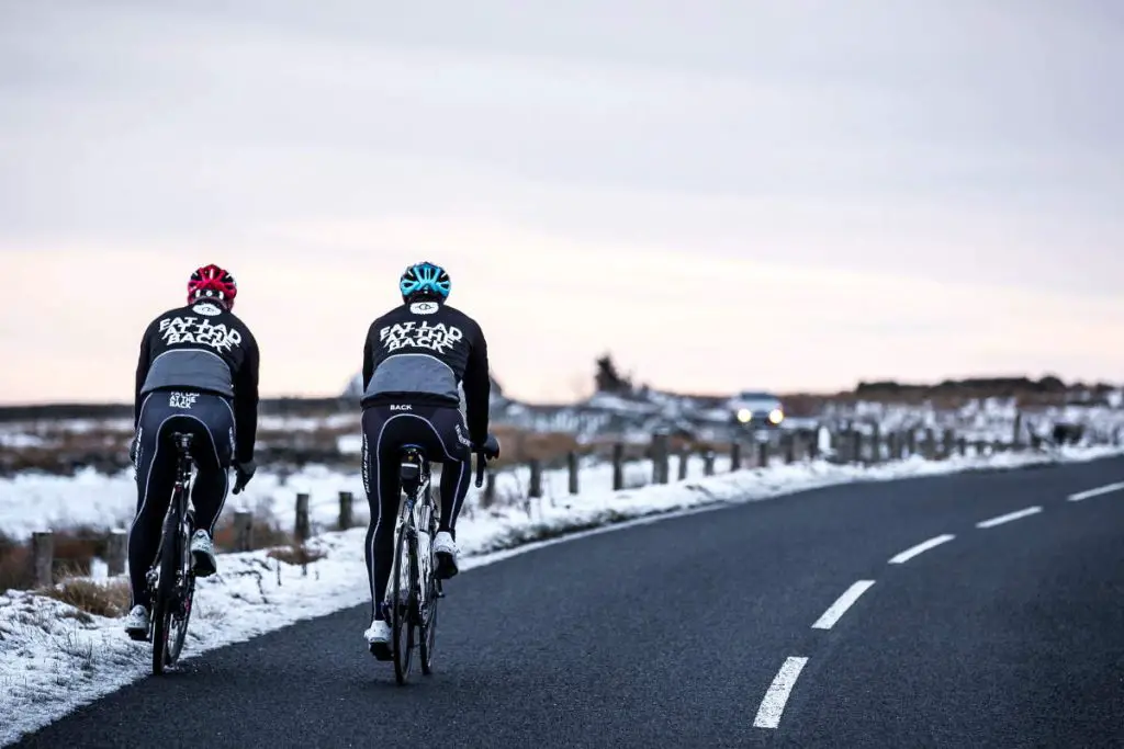 Two cyclists in winter