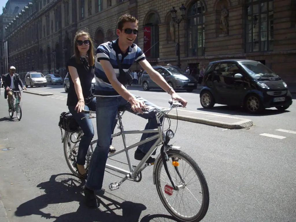 A Couple on a tandem bike in Paris
