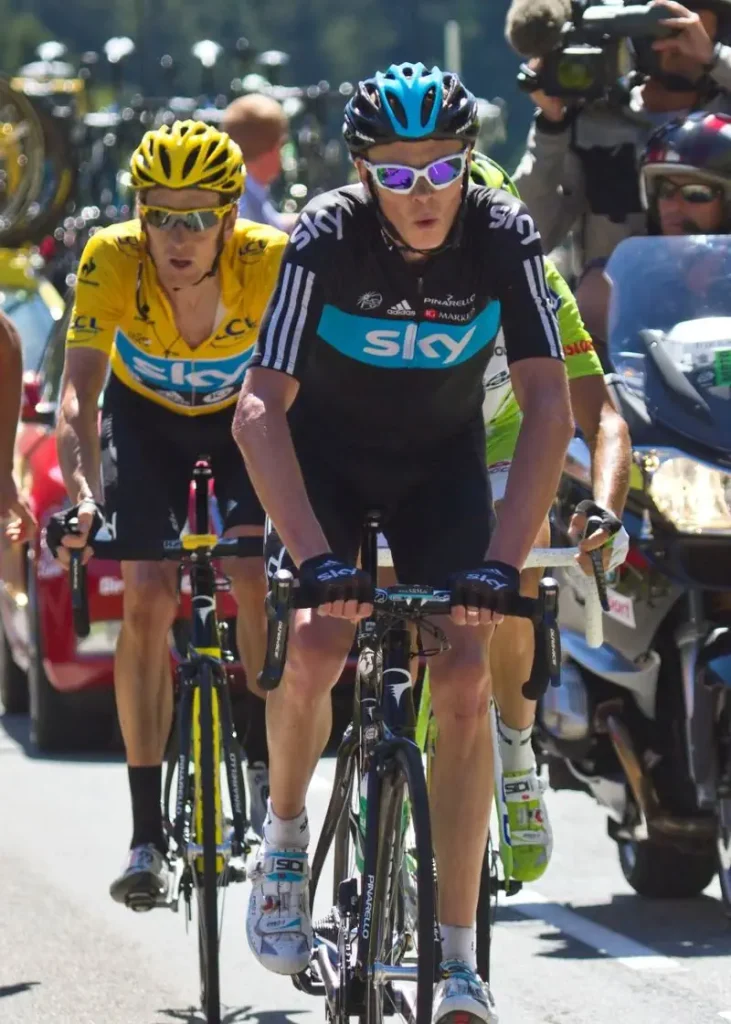 Chris Froome pulling Bradley Wiggins (yellow jersey) in the 2012 Tour de France. Froome went on to win the 2013 Tour de France. Chris Froome was an excellent example of a super domestique cyclist.