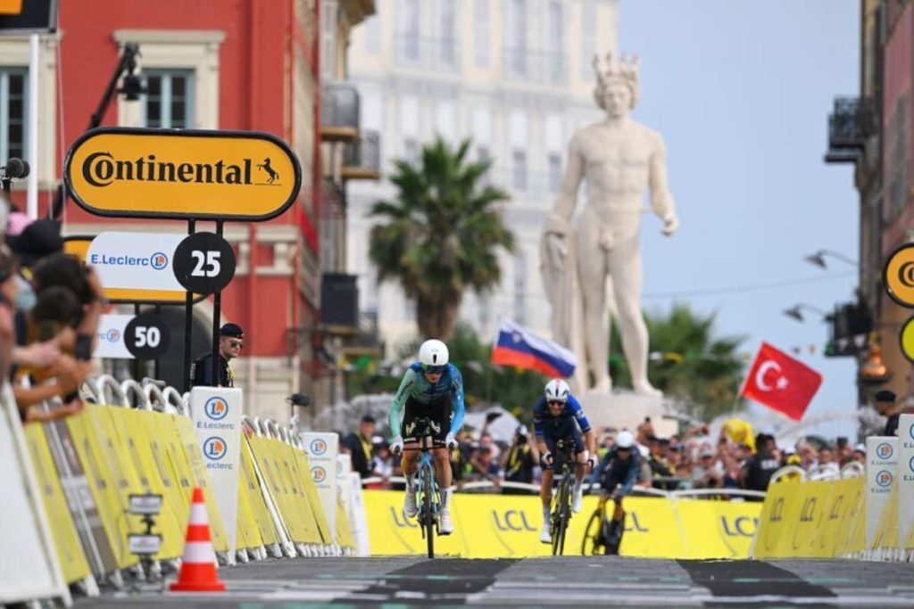 Turkish flag waves prominently at the finish of the last stage of the 2024 Tour de France